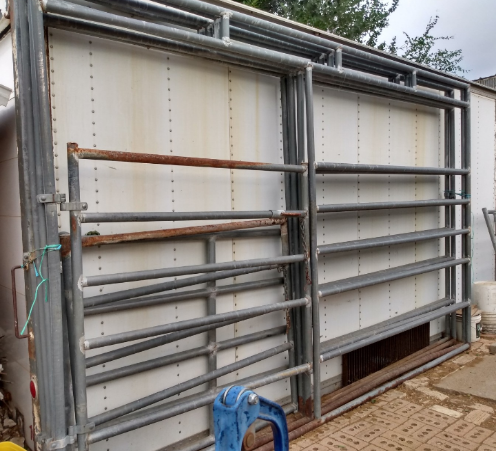 Walk thru gates with attached panel