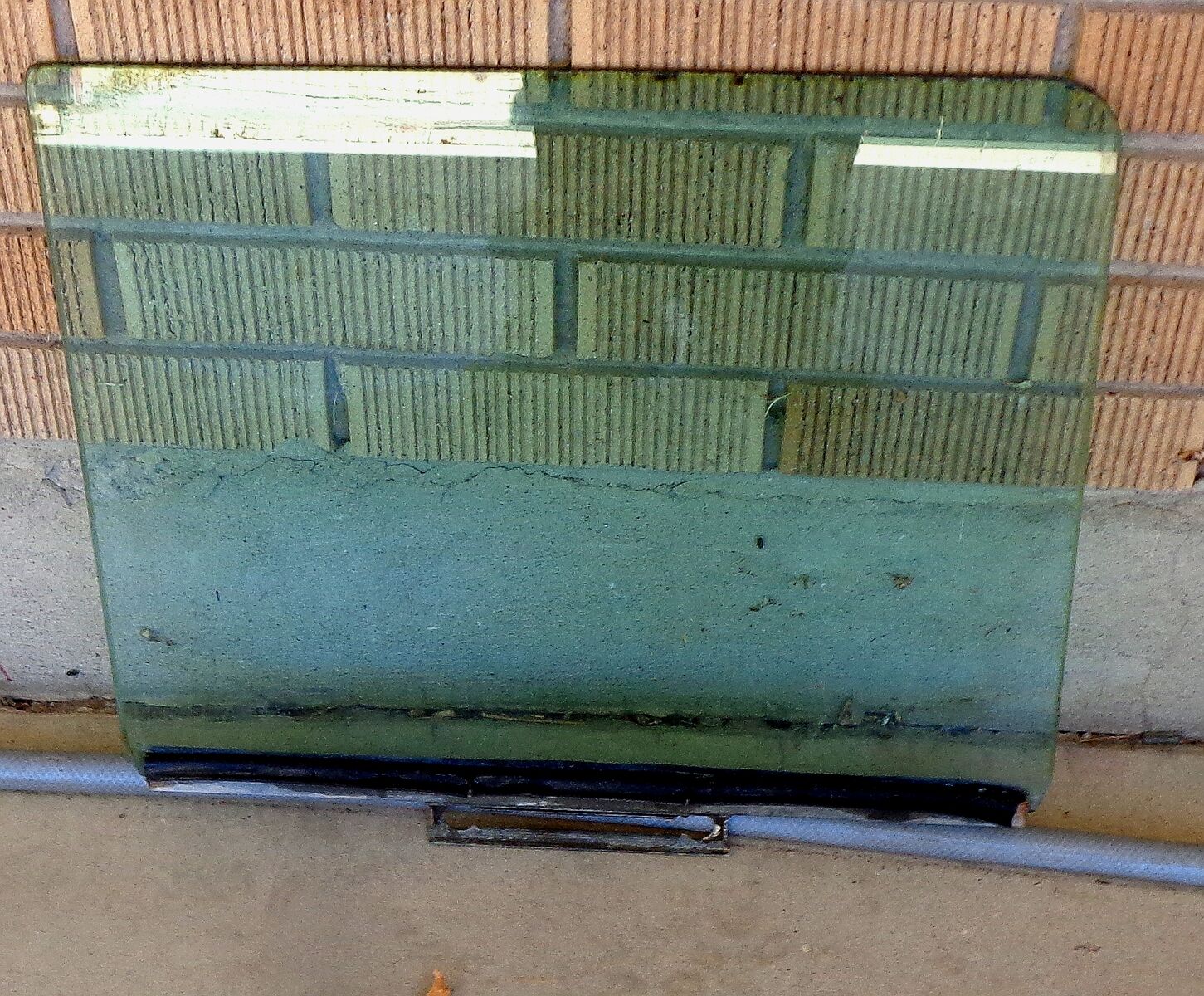 Drivers Front tinted Glass from a 1955 Dodge Royal Custom Sedan