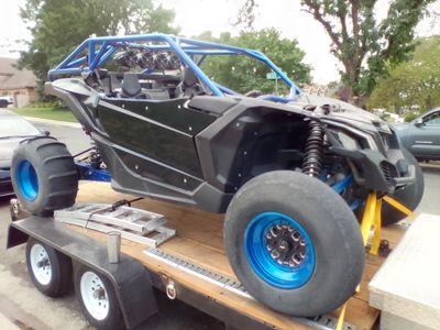 Trade or sale Custom Built Side-by-Side UTV with Blue Roll Cage and Paddle Tires and built tuned