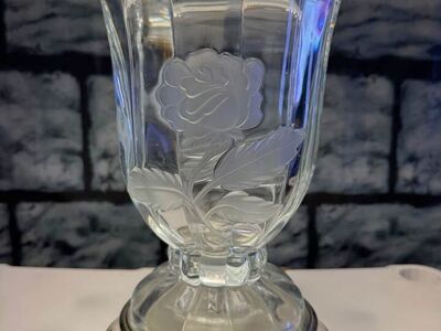 Glass or crystal lamp with two embossed roses and white shade.