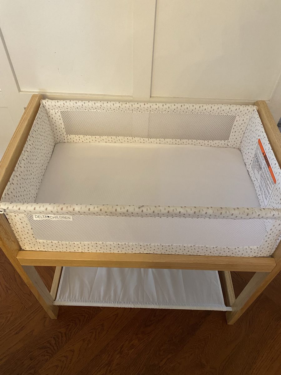Delta Children’s wooden bassinet