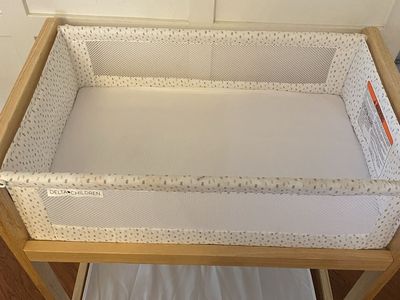 Delta Children’s wooden bassinet