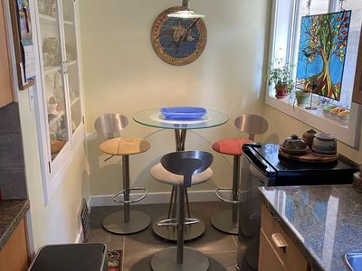 Glass Top Bistro Table with 4 Adjustable Swivel Bar Stools - Modern Dining Set