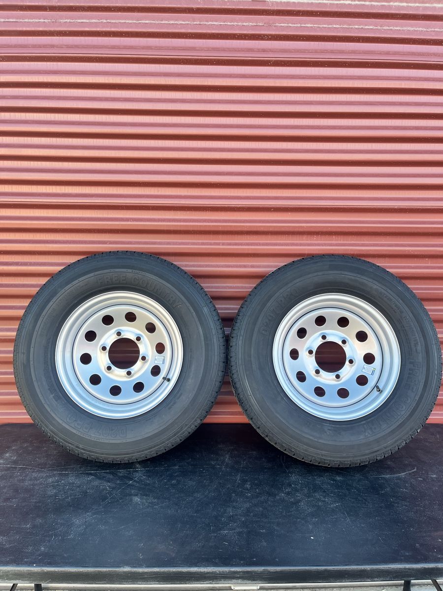 Set of 2 Free Country ST 225/75 R 15 Trailer Tires Mounted on New Silver Wheels Standard 6 Lug Pattern.                     Bran
