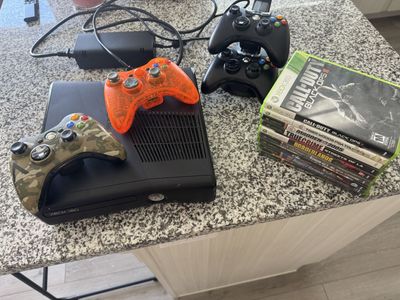 Xbox 360 with controllers and games