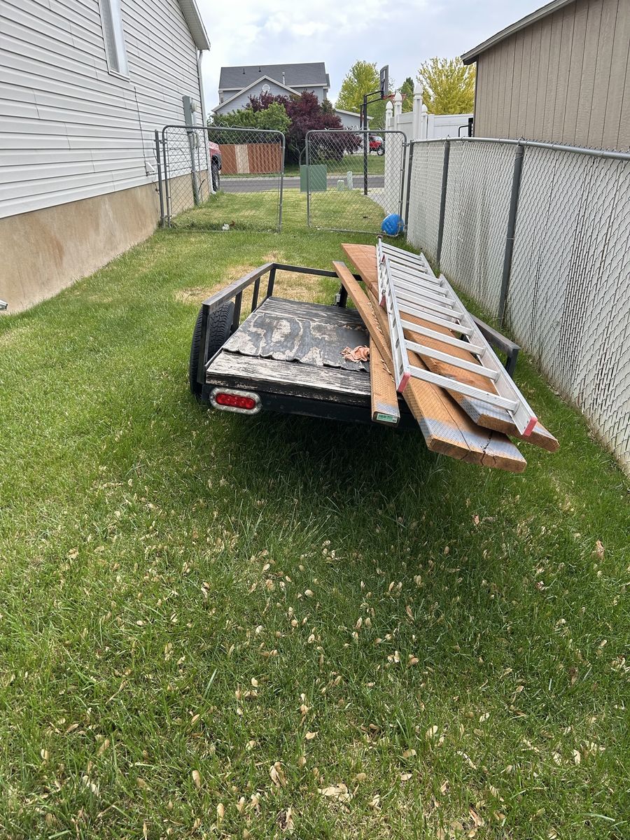 Utility Trailer with Wood Planks and Ladder