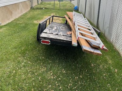 Utility Trailer with Wood Planks and Ladder