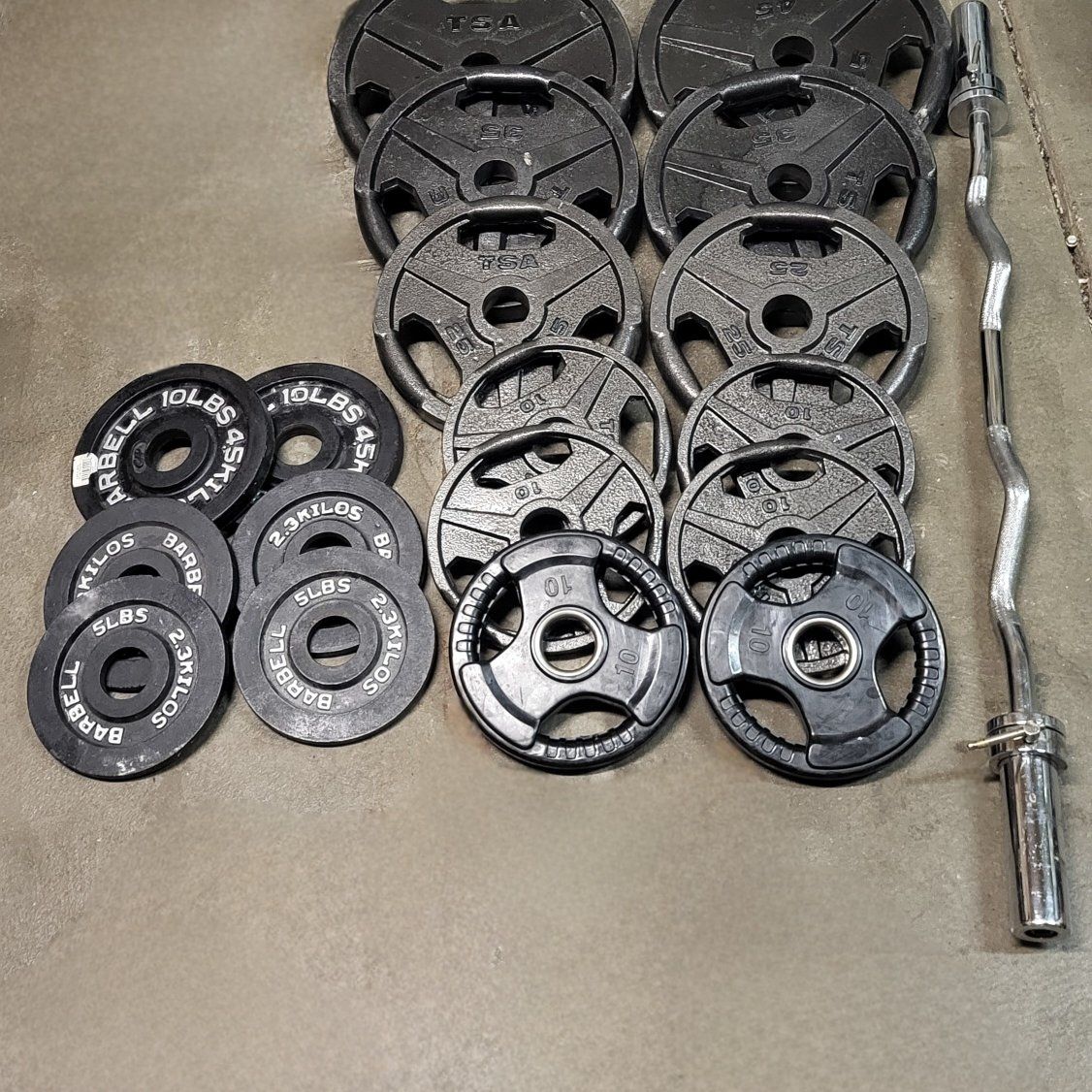 310 pounds of Olympic weights