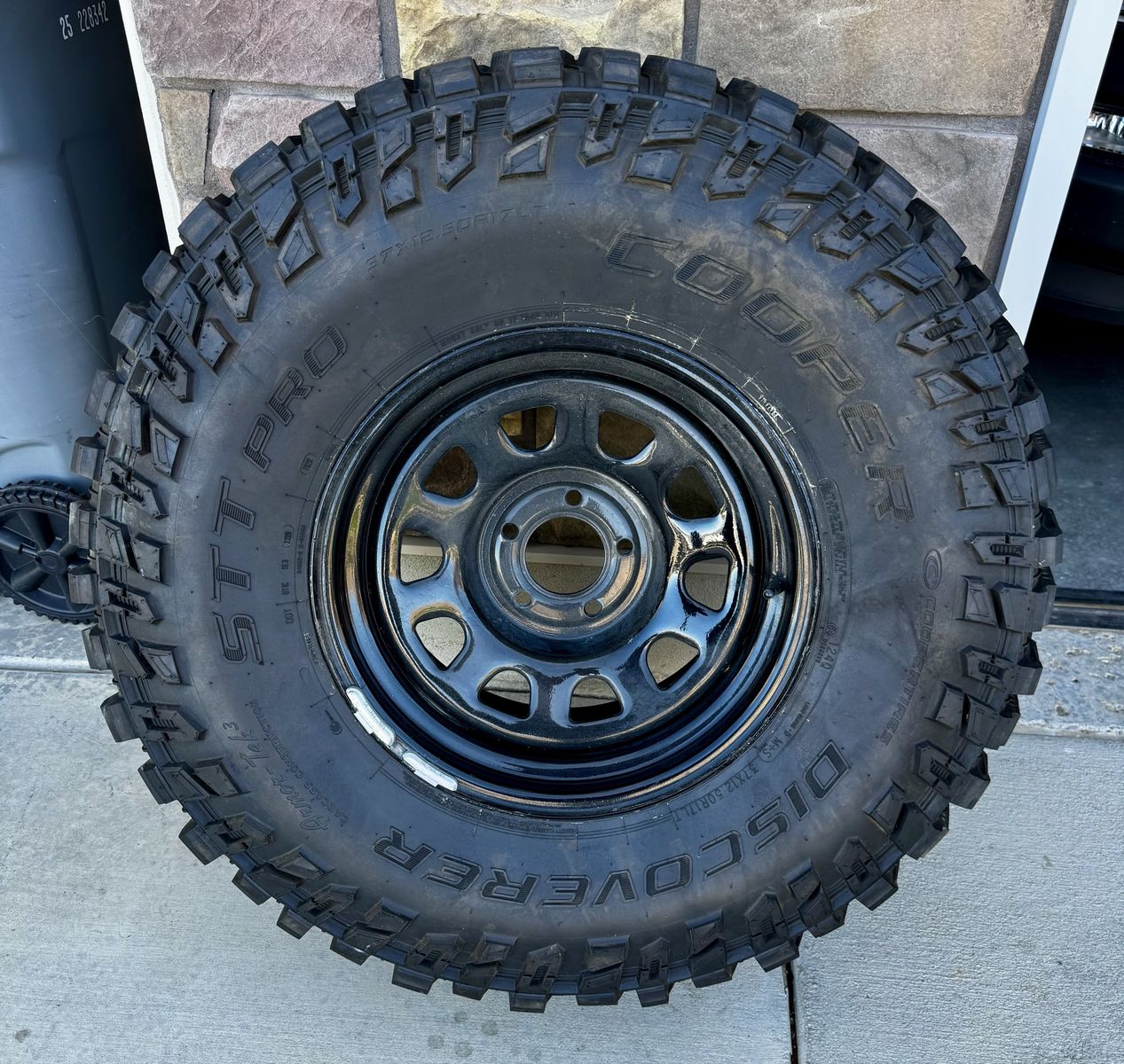 Cooper Discoverer STT Pro 37x12.50R17LT Tire on Black Steel Wheel
