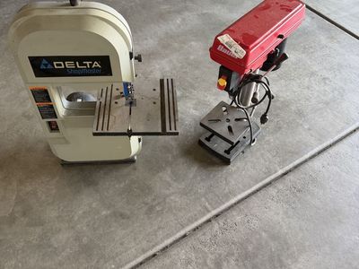 Delta 1/3 horse power ban saw, and a Harbor Freight Baur drill press.