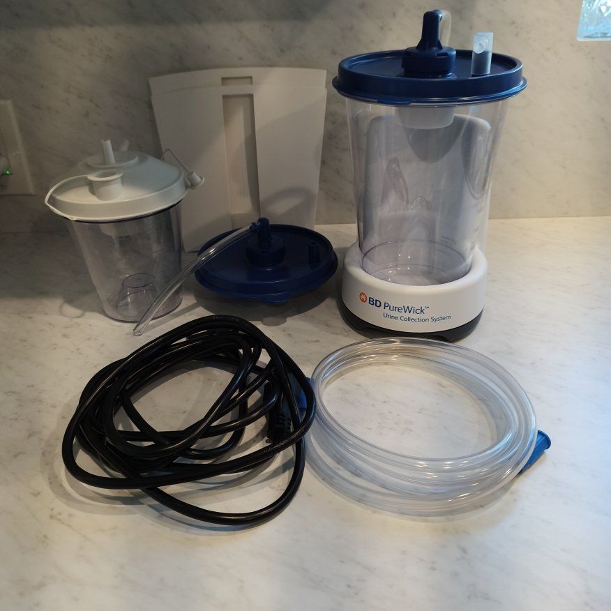 PureWick urine collection system with battery