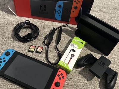 Nintendo Switch Console with Neon Blue and Red Joy-Cons and Accessories