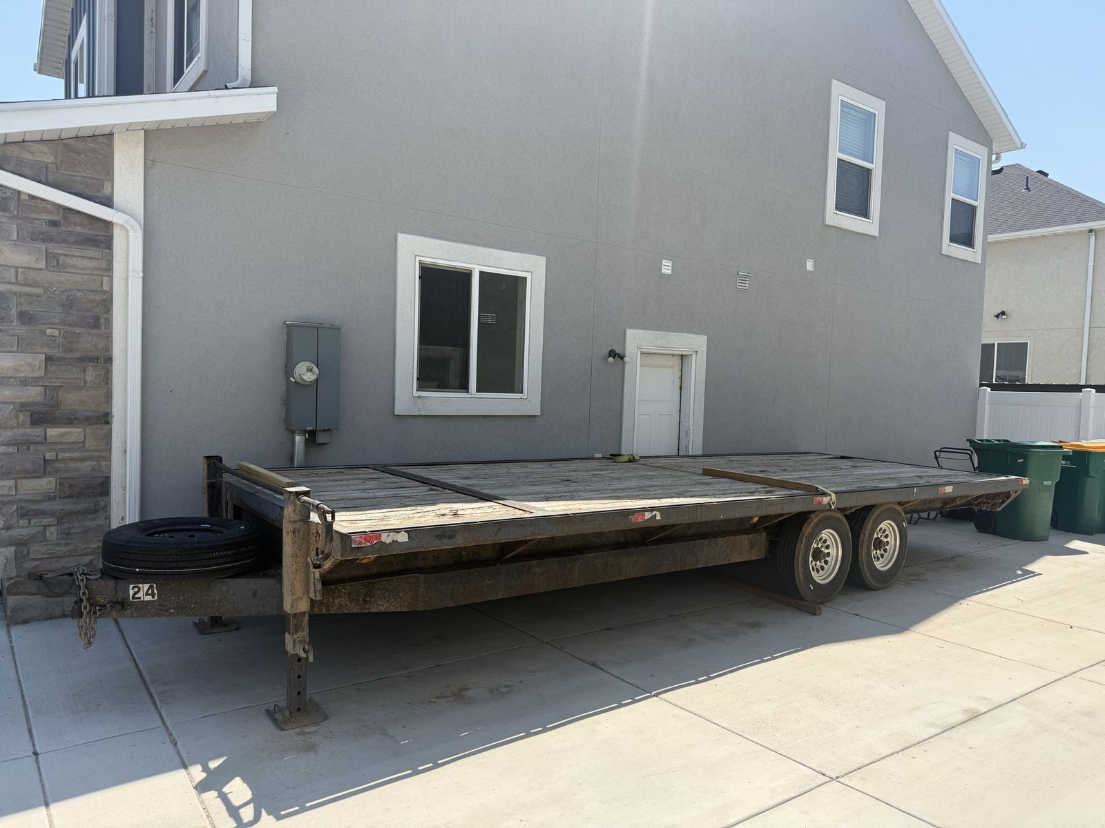 Heavy-Duty Dual-Axle Flatbed Utility Trailer with Spare Tire