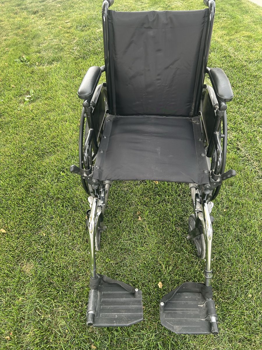 Standard Wheelchair with Black Upholstery and Footrests