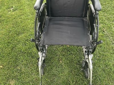 Standard Wheelchair with Black Upholstery and Footrests