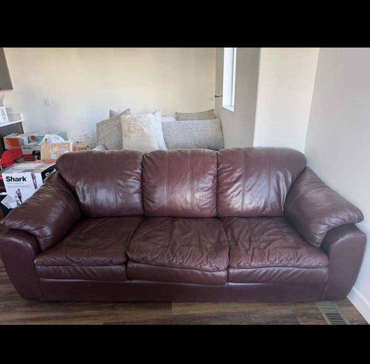 Brown/red leather couch