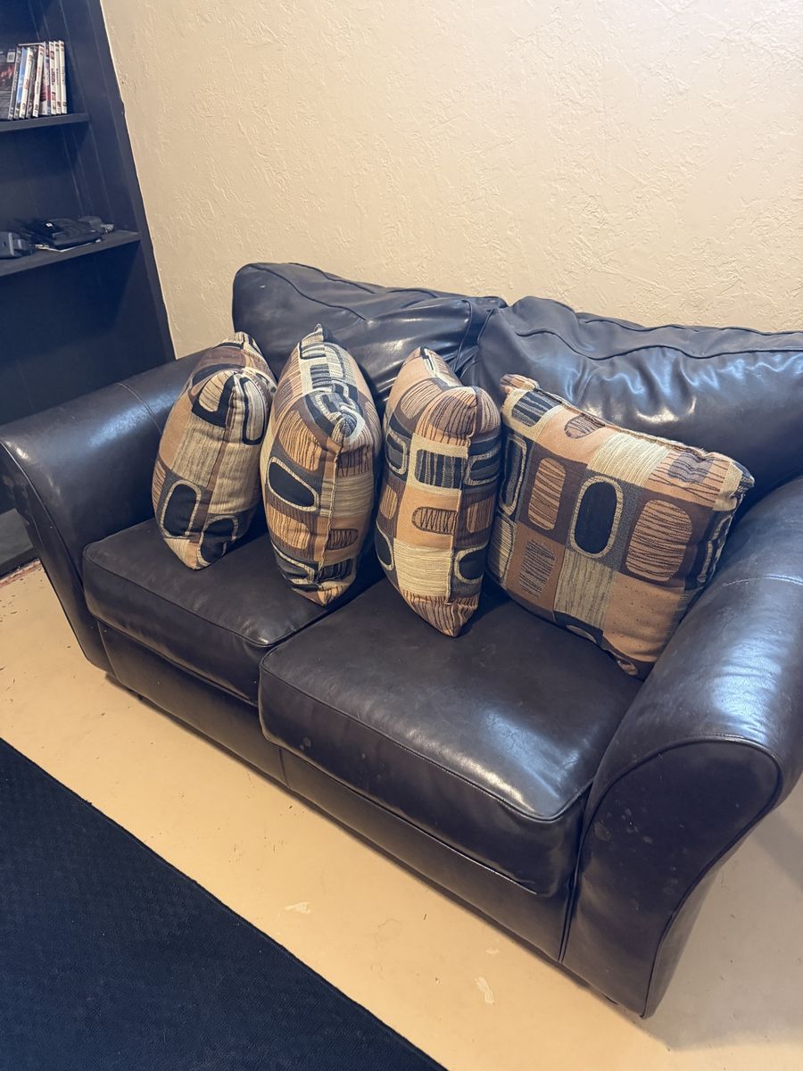 Dark Faux Leather Loveseat with Patterned Throw Pillows - Compact 2-Seater Sofa
