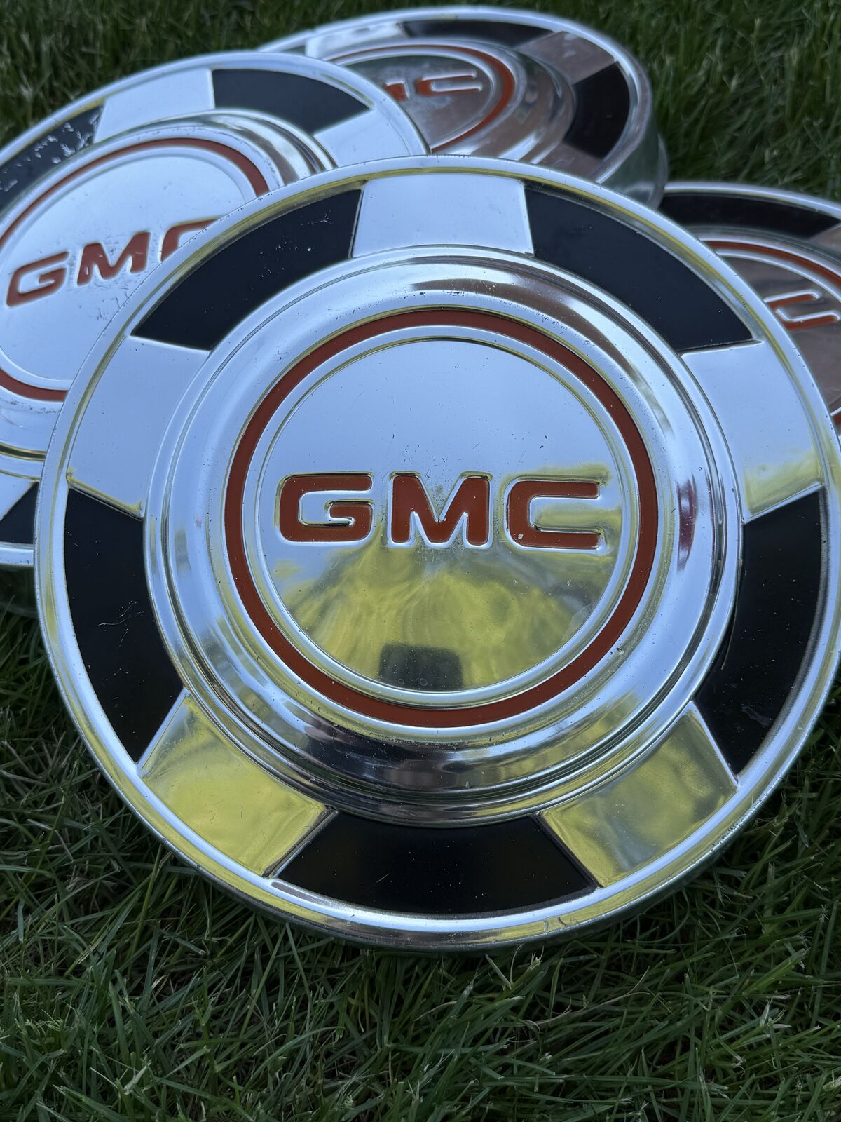 Vintage GMC Dog Dish Hubcaps – Full Set, Black & Orange