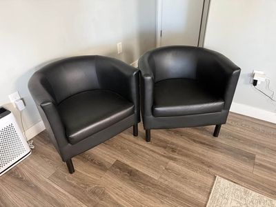 Two black accent chairs