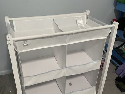 Baby holding dresser