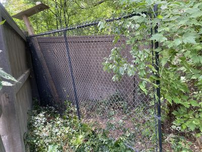 Double panel of black chain-link fence