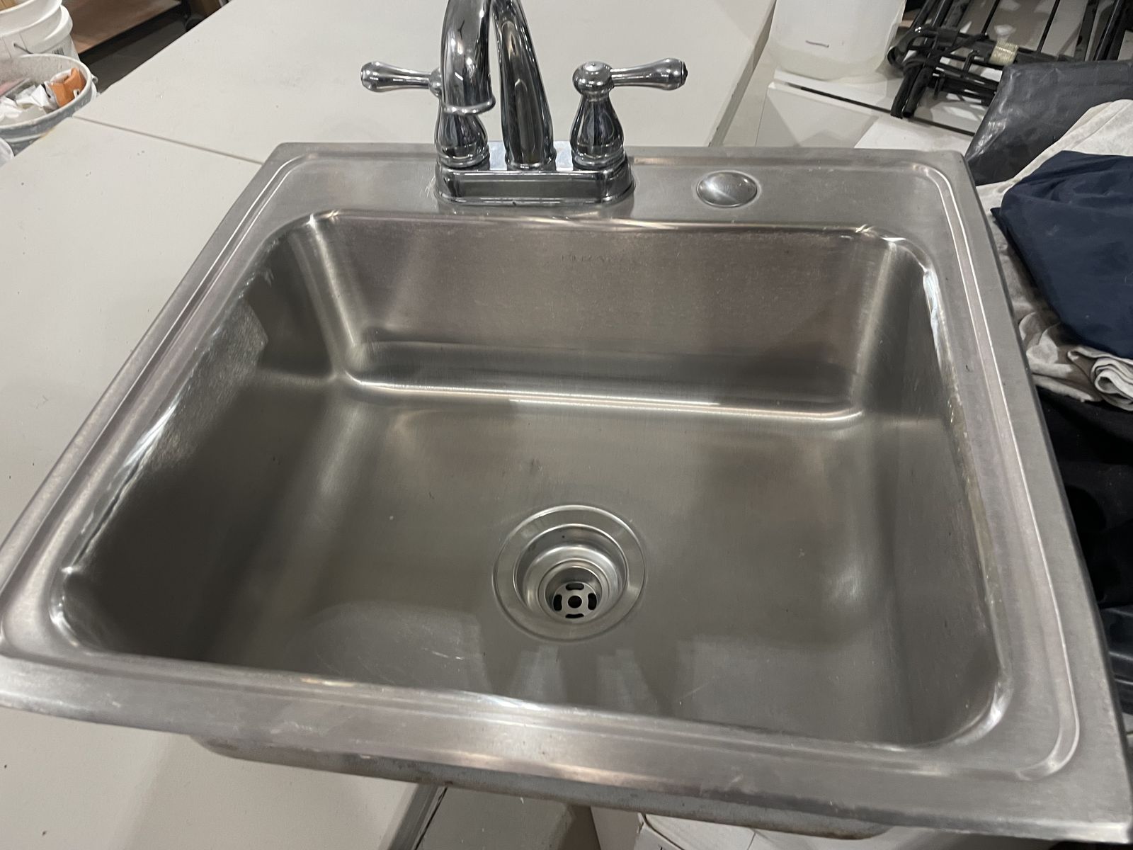 Stainless steel sink with faucet