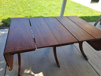 Duncan Phyfe style Large Wood Dining Table with Extension Leaves - Vintage Style Pedestal Legs, Dark Wood Finish, drop ends.