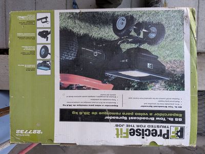 PULL BEHIND BROADCAST FERTILIZER SPREADER, NEVER USED, NEVER BEEN OUT OF THE BOX