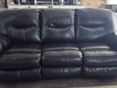 Black Faux Leather Reclining Sofa. Well loved and comfortable. Just a little worn.