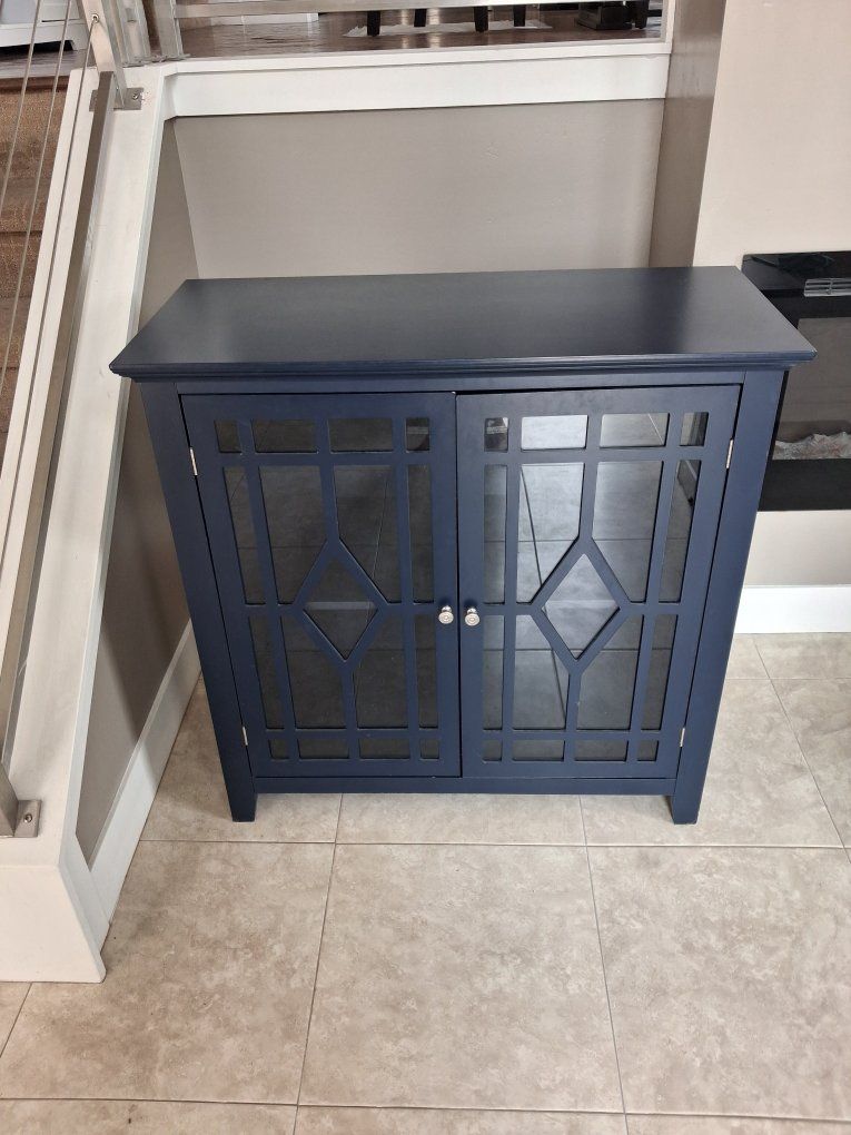 Decorative blue, glass door end table.  Two available.