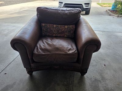 Used Brown Leather Club Chair with Decorative Nailhead Trim and Wooden Base