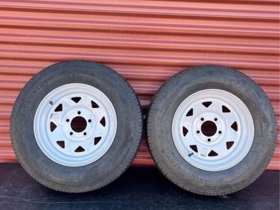 Set of 2 Free Country ST 205/75 D 14 Trailer Tires Mounted on New White Spoke Wheels 5 on 4.5 Lug Pattern. Brand New