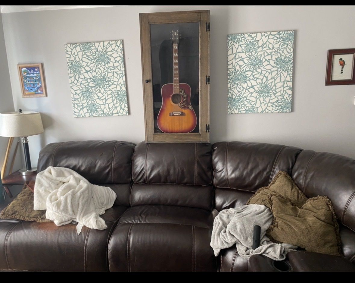 Genuine leather sofa with 2 electric recliners and 1 manual recliner. There are also 2 cupholder and storage sections available.