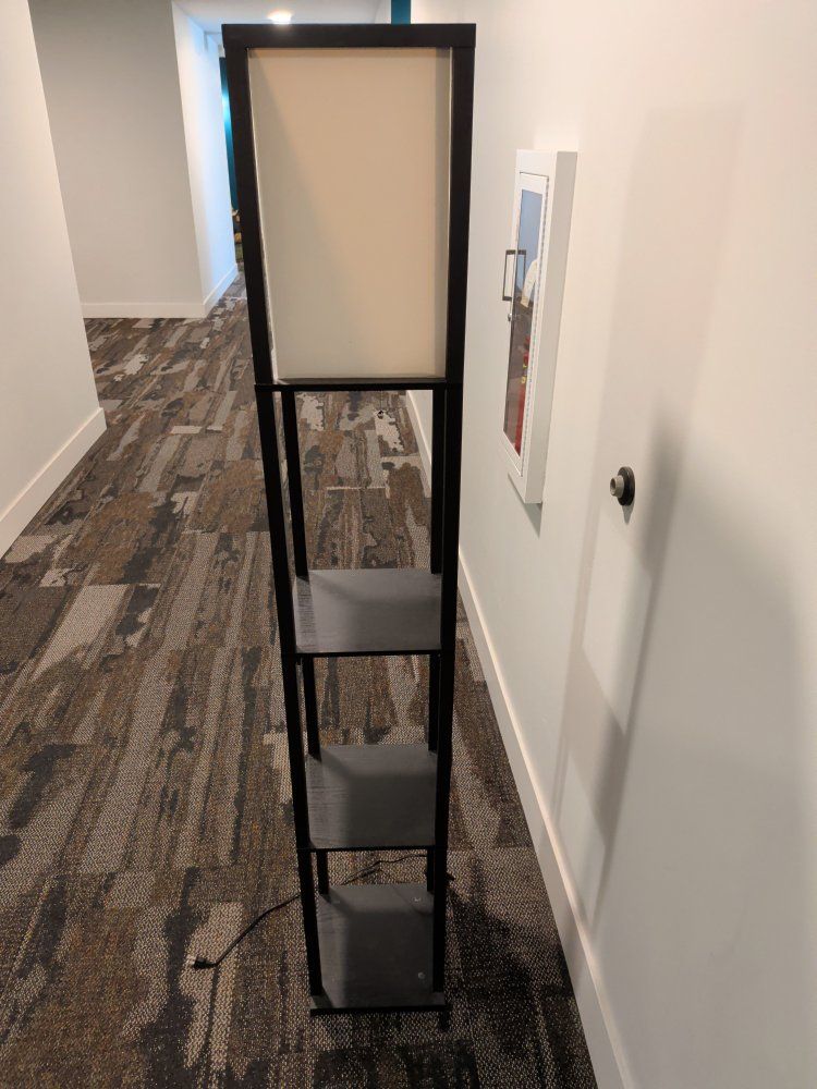 Modern Black Frame Floor Lamp with 4-Tier Storage Shelves and Cream Shade