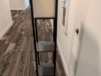 Modern Black Frame Floor Lamp with 4-Tier Storage Shelves and Cream Shade