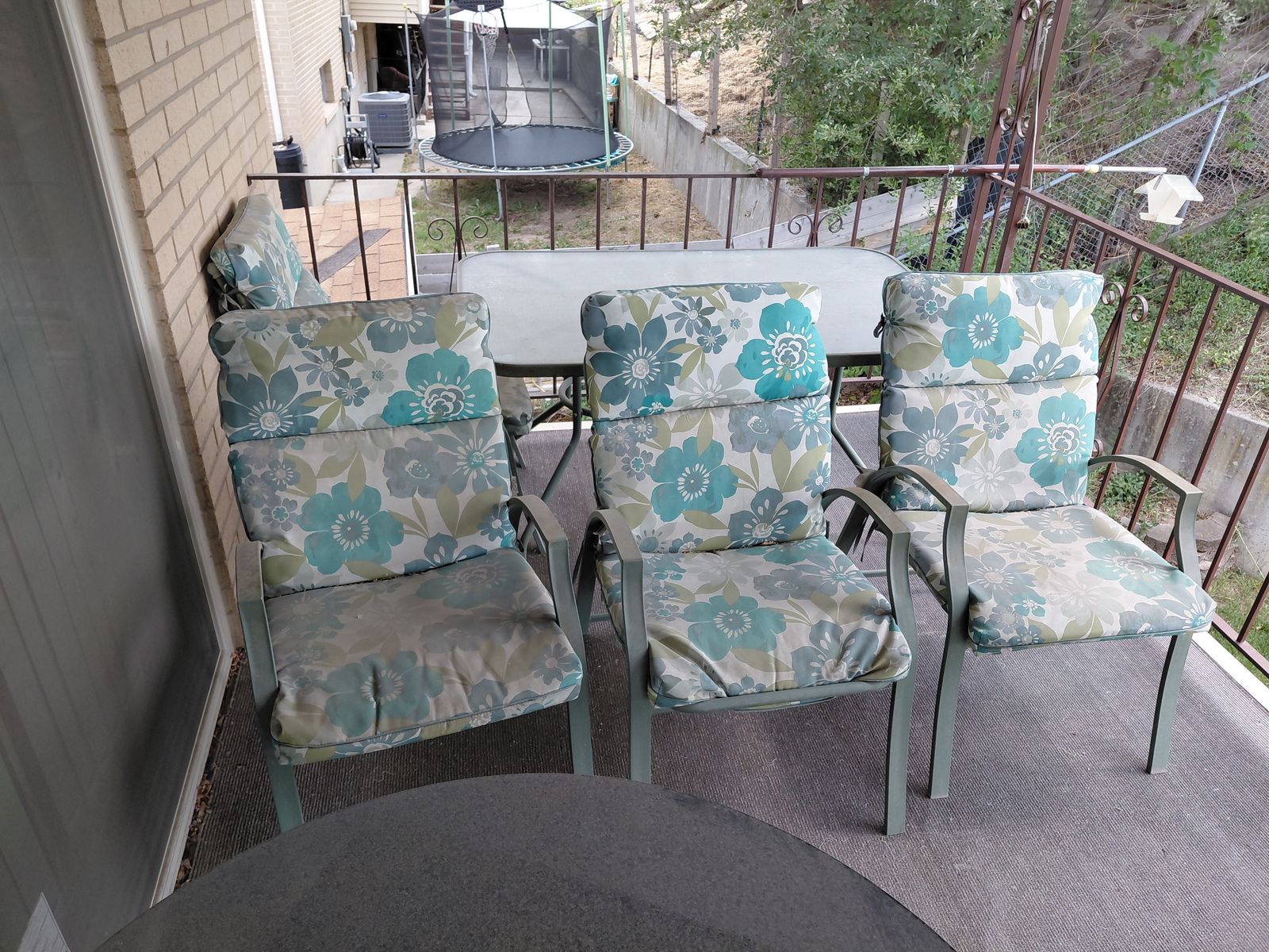 Glass Top Patio Table and Four Padded Chairs