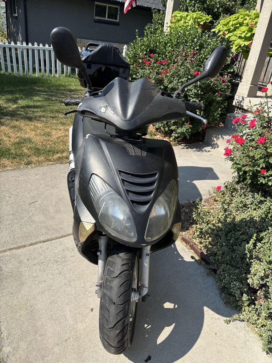 Black Motor Scooter with Rear Storage Box