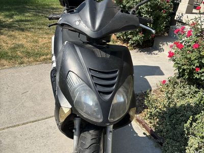 Black Motor Scooter with Rear Storage Box