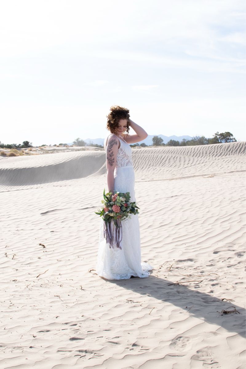 White Lace Wedding Dress with Plunging V-Neckline and Train