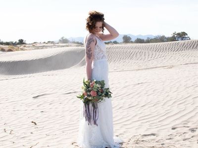 White Lace Wedding Dress with Plunging V-Neckline and Train