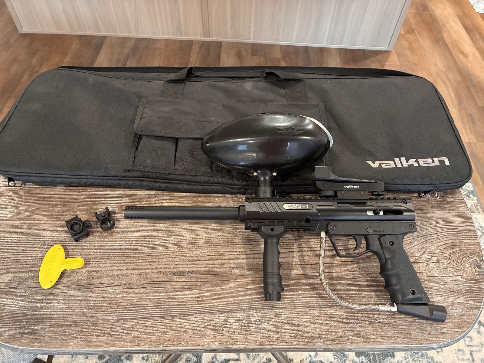 Valken SW-1 paintball gun with case and accessories.