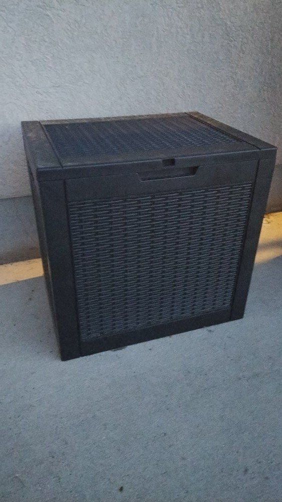 1 Smaller black outdoor misc toy shed in box