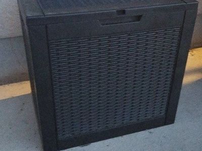 1 Smaller black outdoor misc toy shed in box