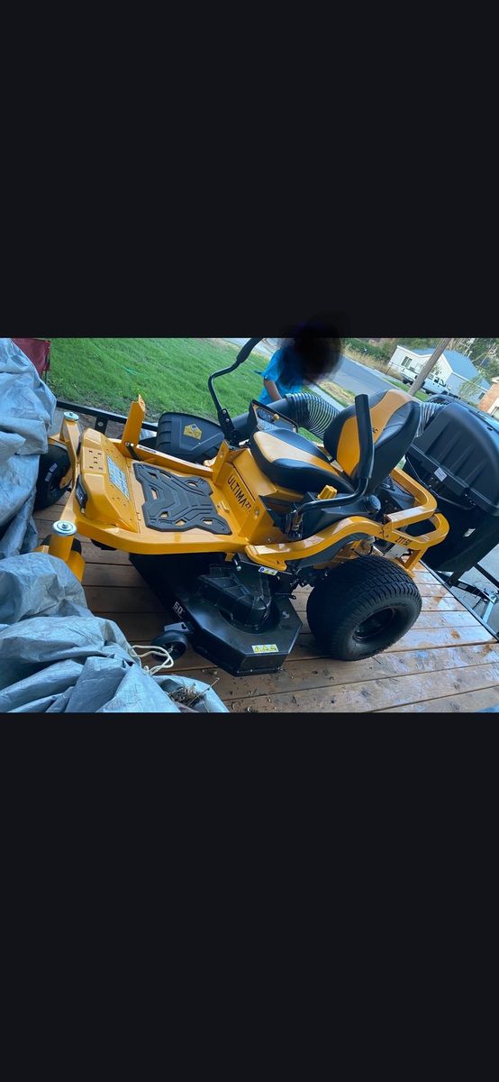 Riding lawnmower and trailer for sale (both new)