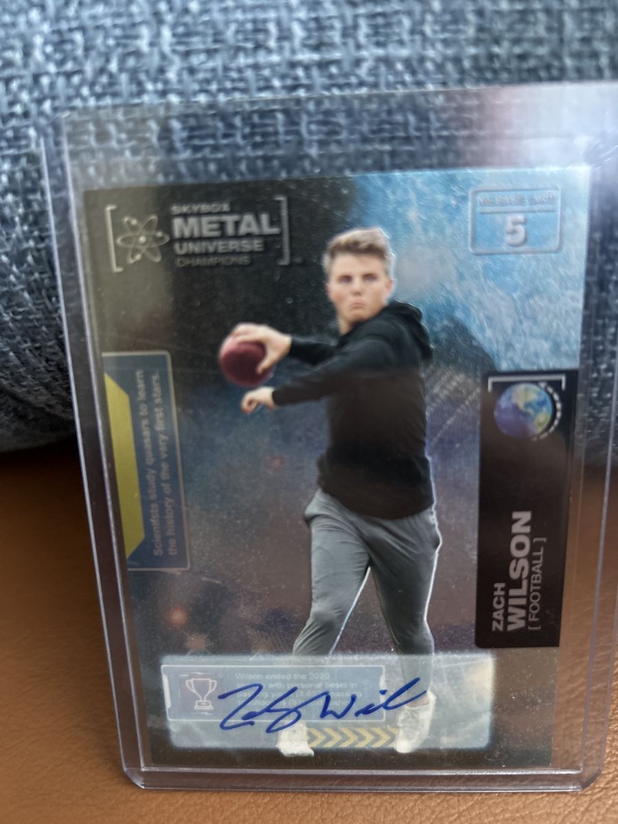 2021 Certified Rookie Auto Skybox Metal Universe Champions Zach Wilson Autographed Football Card. BRIGHAM YOUNG COUGARS BYU RC