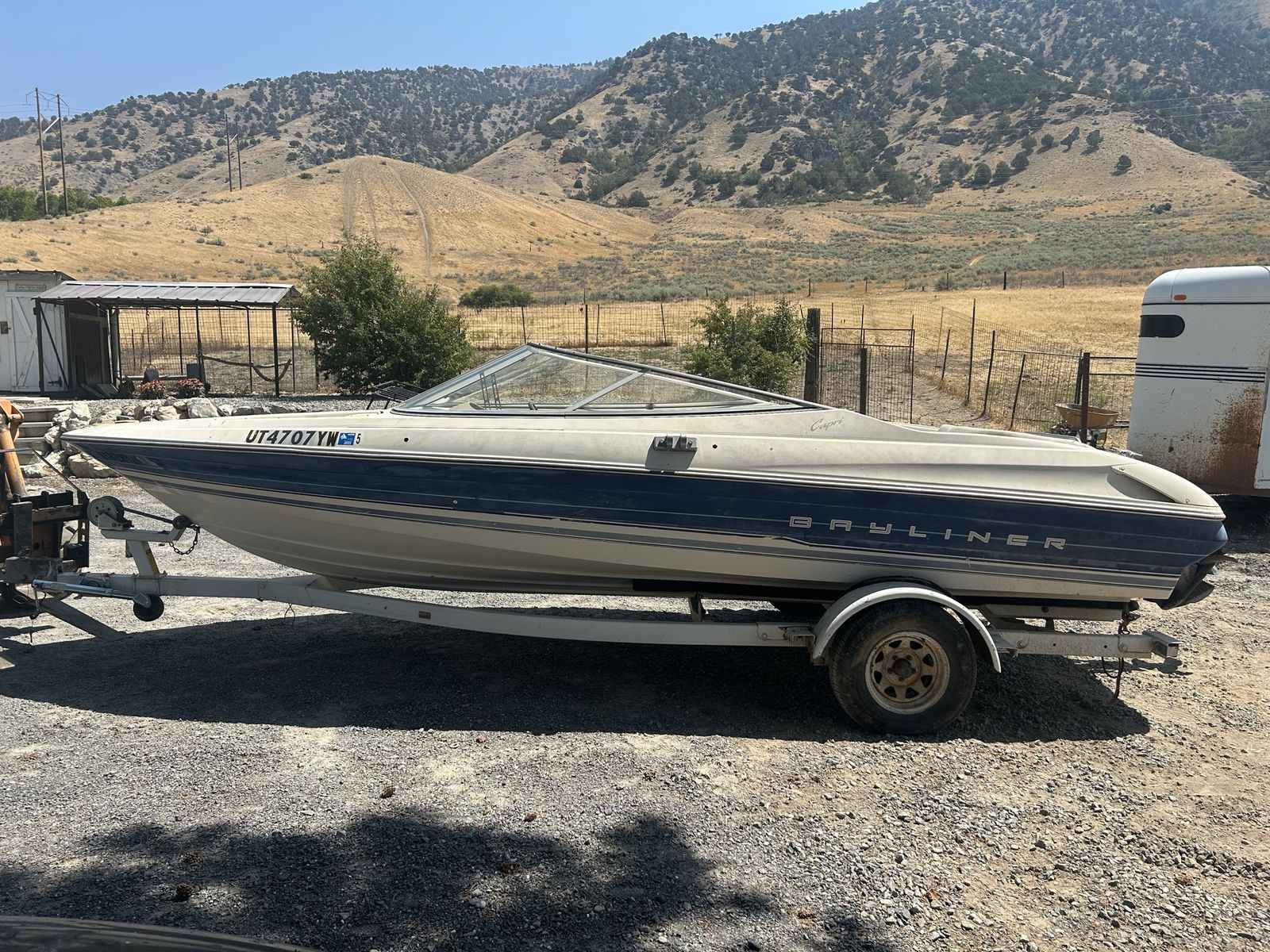 Bayliner Capri Power Boat with Single Axle Trailer. As is or parting out.