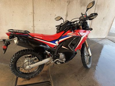 Honda CRF250L Rally Motorcycle - Red, Black, and Blue Dual Sport