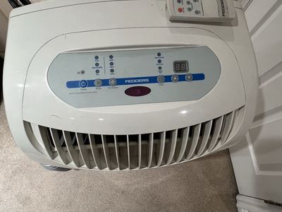 This is a Fedders/Maytag 9,000 BTU portable air conditioner, model M6P09S2A*B
