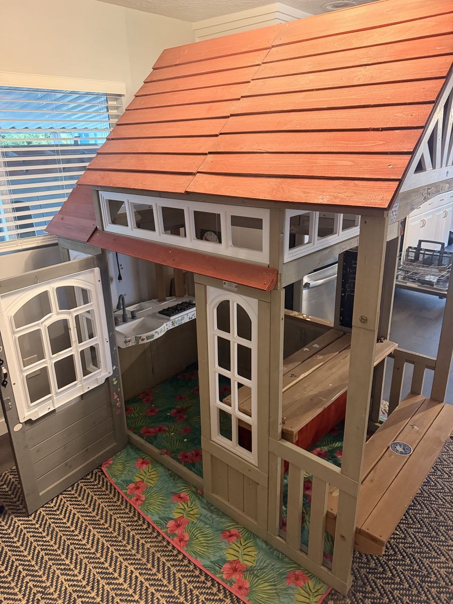 Kid sized wooden playhouse 