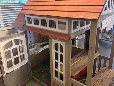 Kid sized wooden playhouse